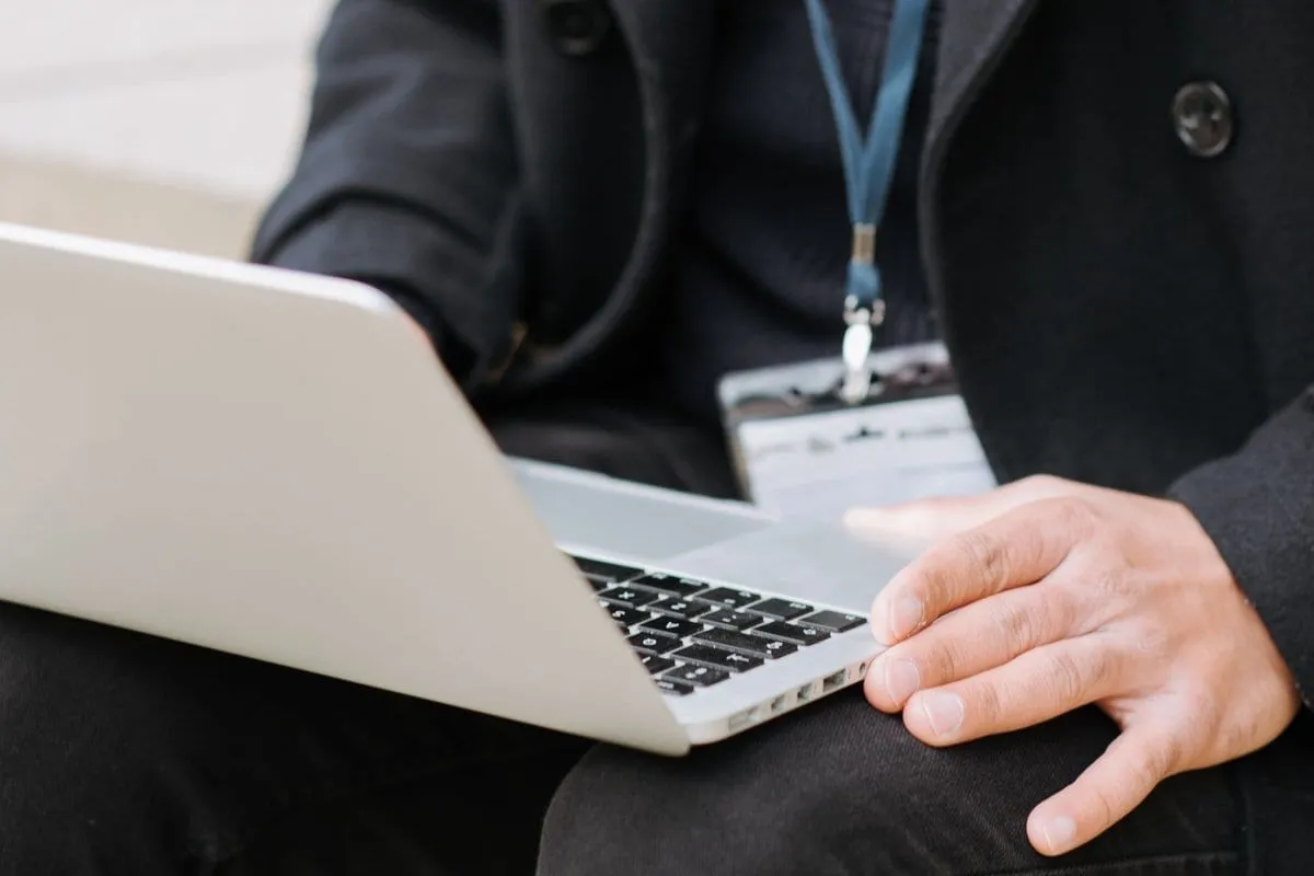 A back-office team member working at a laptop