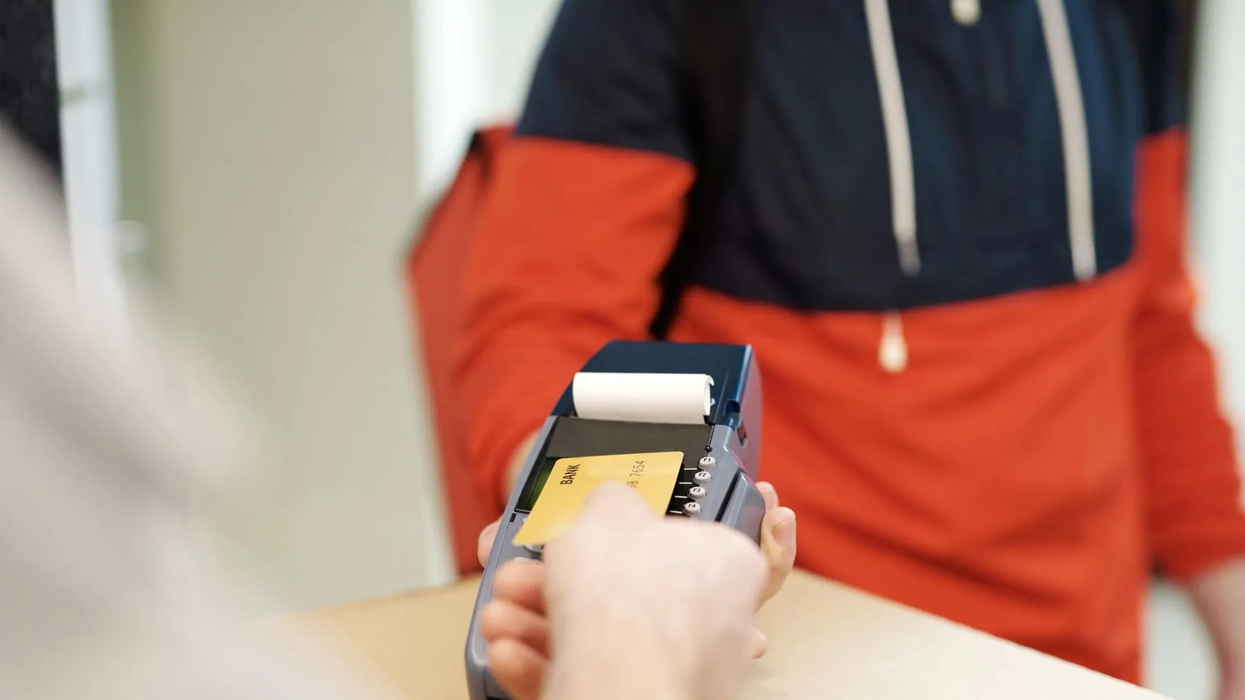 A customer making a contactless card payment